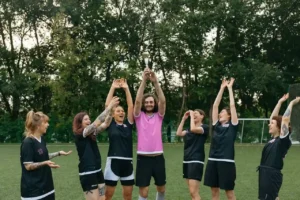 Fantasy football team celebrating a big win perfect inspiration for creative Breece Hall fantasy team names.