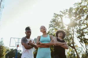 Energetic fitness team running and training together outdoors, symbolizing motivation, unity, and strength