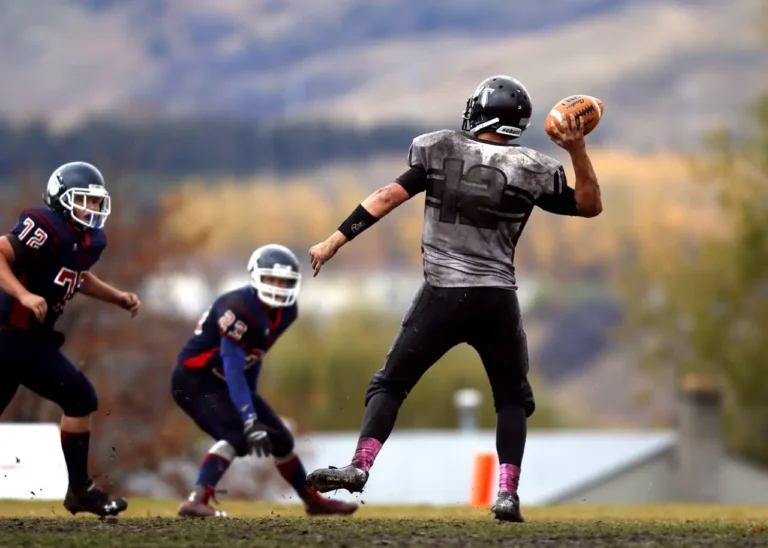 Football players standing confidently on the field, ready for competition