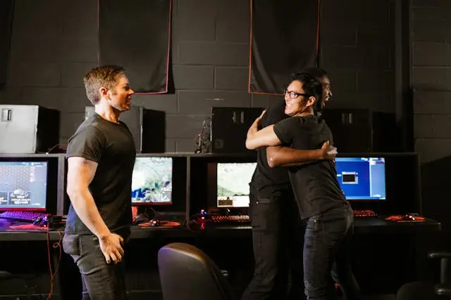 A professional Free Fire esports team posing with gaming gear under neon lights, symbolizing teamwork, energy, and competitive spirit.