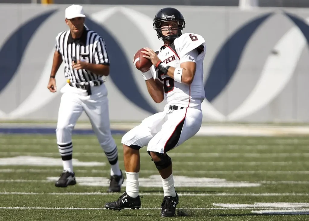 Football player running with the ball during a game